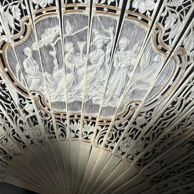 Sale Photo Thumbnail #390: Professionally framed, 25 x 29 3/4 inches
The top fan is Spanish origin, the bottom fan is French.  
Amazing hand painted antique fans, you will be stunned at the details.

The Spanish fan is likely from the 18th or 19th century, featuring carved and pier