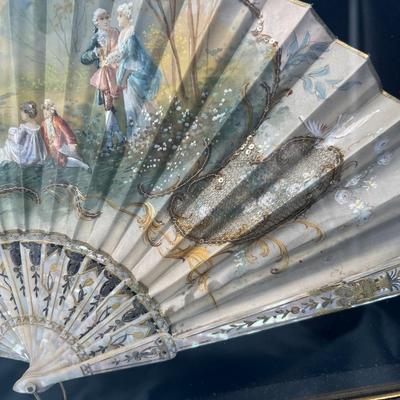 Sale Photo Thumbnail #402: Hand painted silk fan with etched mother of pearl, French courting  scene.  In a beautiful gold tone shadowbox, 23 x 15 inches.  
Retails at $300-$500