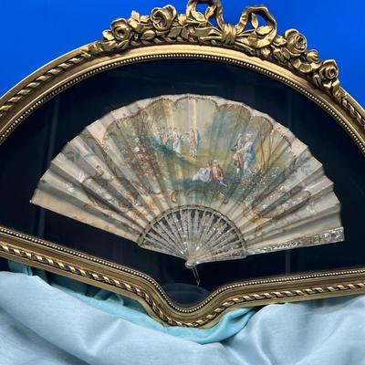 Sale Photo Thumbnail #403: Hand painted silk fan with etched mother of pearl, French courting  scene.  In a beautiful gold tone shadowbox, 23 x 15 inches.  
Retails at $300-$500