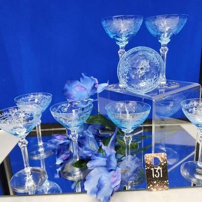 Sale Photo Thumbnail #407: Crystal, Rare, beautiful 5" stemmed glasses.  12  stems  (only 8 are pictured) 
Retail is $70.00 per stem 
This coupe style glassware is making a comeback for craft cocktails
like the martini, daiquiries, and manhattan.  
Also as a dessert glass for ice c