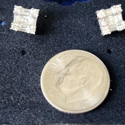 Sale Photo Thumbnail #411: 750 stamped, 18K white gold.  
The diamonds are round and emerald cut in this pair.  
This pair just sparkles!