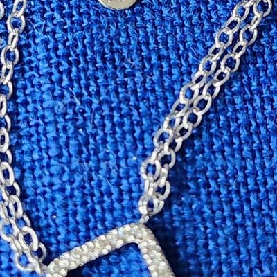 Sale Photo Thumbnail #416: 14 K gold stamped pendant with diamonds.
The 16 inch double  chain is not marked, likely sterling