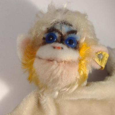Sale Photo Thumbnail #905: Vintage Steiff Mungo Monkey Hand Puppet Doll- Approx 8 1/2" Tall.  Item is complete with original ear tag.