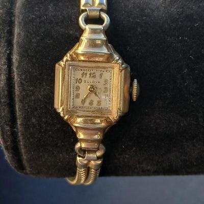vintage Bulova ladies' watch, likely from the 1940s to 1960s, with a 10k gold-filled case and a manual wind-up movement. 12 k gf
