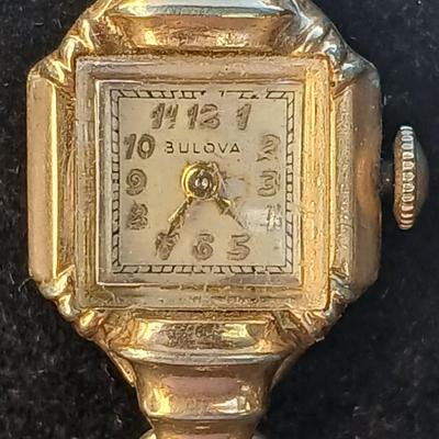 vintage Bulova ladies' watch, likely from the 1940s to 1960s, with a 10k gold-filled case and a manual wind-up movement. 12 k gf