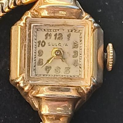 vintage Bulova ladies' watch, likely from the 1940s to 1960s, with a 10k gold-filled case and a manual wind-up movement. 12 k gf