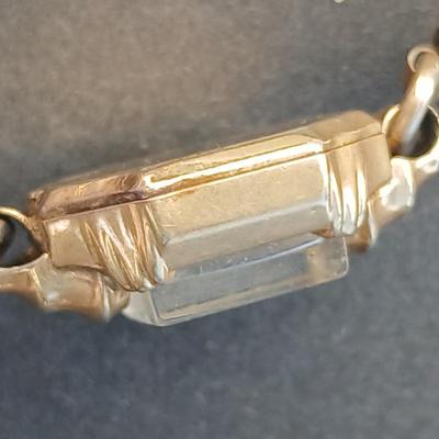 vintage Bulova ladies' watch, likely from the 1940s to 1960s, with a 10k gold-filled case and a manual wind-up movement. 12 k gf