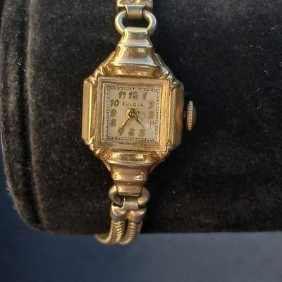 vintage Bulova ladies' watch, likely from the 1940s to 1960s, with a 10k gold-filled case and a manual wind-up movement. 12 k gf