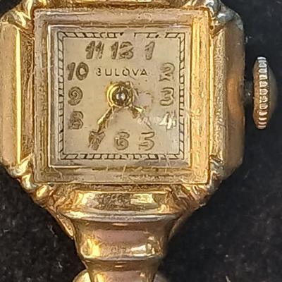 vintage Bulova ladies' watch, likely from the 1940s to 1960s, with a 10k gold-filled case and a manual wind-up movement. 12 k gf