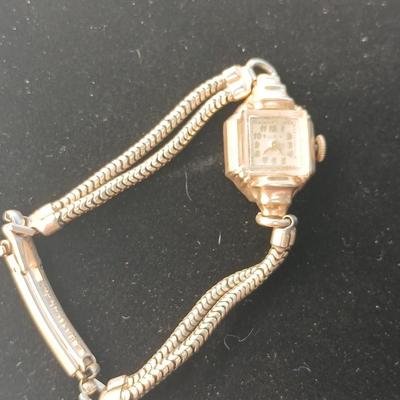 vintage Bulova ladies' watch, likely from the 1940s to 1960s, with a 10k gold-filled case and a manual wind-up movement. 12 k gf