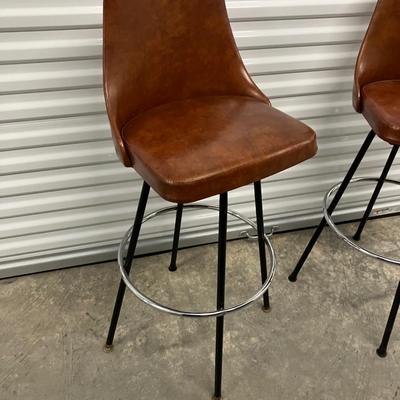 1970s Cosco Cognac Pair of Brown Swivel Barstool Chairs.
