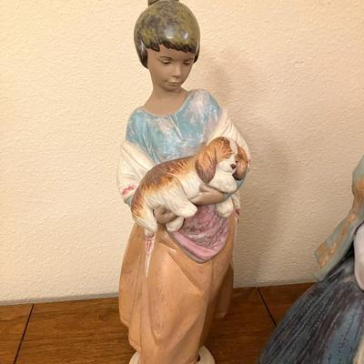 Sale Photo Thumbnail #110: Beautiful Lladro figurine featuring "Pampered Puppy" from the Country Joy collection. Measures 17.5" tall.