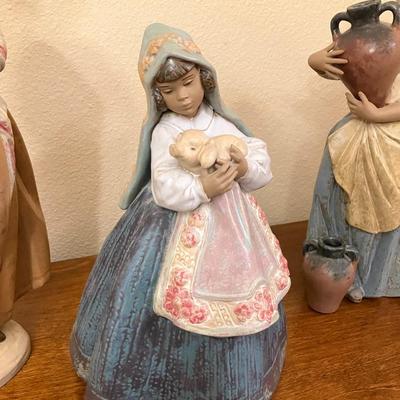 Sale Photo Thumbnail #111: Beautiful Lladro figurine featuring "Girl with Pig" from the Country Joy collection. Measures 12.5" tall.
