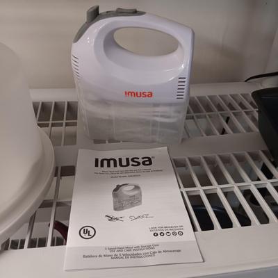 IMUSA HAND MIXER, WILTON LOAF PAN AND A CAKE CARRIER