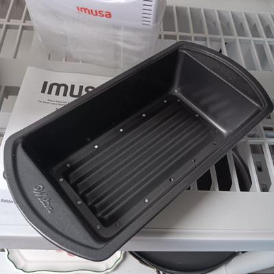 IMUSA HAND MIXER, WILTON LOAF PAN AND A CAKE CARRIER
