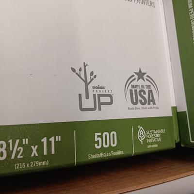9 REAMS OF WHITE COPY PAPER AND AN ELECTRIC PENCIL SHARPENER