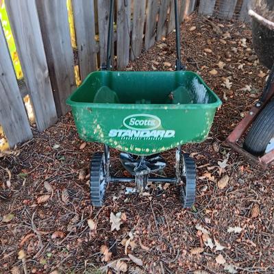WHEELBARROW AND A SPREADER
