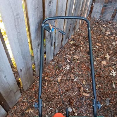 WHEELBARROW AND A SPREADER