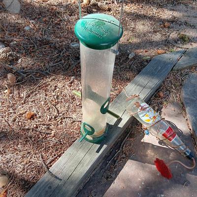 WILD BIRDS UNLIMITED FEEDER AND A COCA-COLA HUMMINGBIRD FEEDER