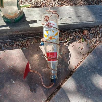 WILD BIRDS UNLIMITED FEEDER AND A COCA-COLA HUMMINGBIRD FEEDER