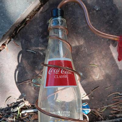 WILD BIRDS UNLIMITED FEEDER AND A COCA-COLA HUMMINGBIRD FEEDER