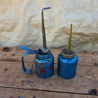 Two blue metal oil cans - Rainbow Pump Eagle Mfg. -