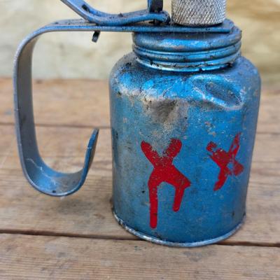 Two blue metal oil cans - Rainbow Pump Eagle Mfg. -