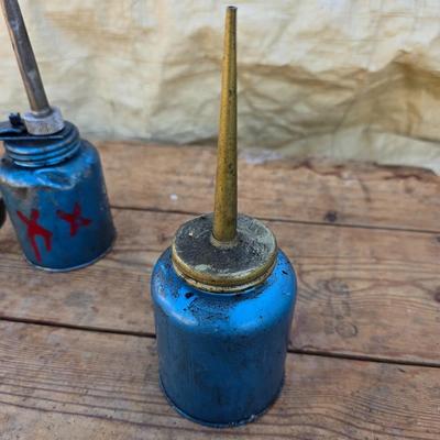 Two blue metal oil cans - Rainbow Pump Eagle Mfg. -