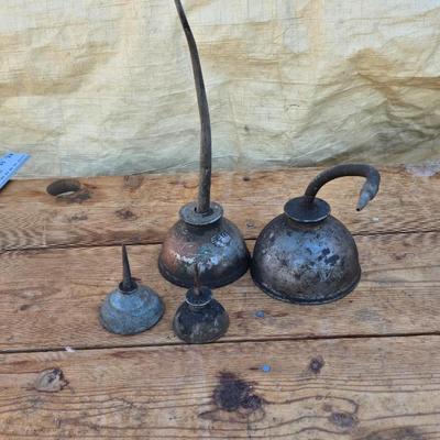 Four vintage oil cans - 2 small thumb press dome cans and 2 larger