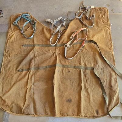 Vintage horse blanket with four old halters