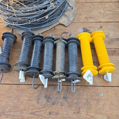 Two Blitzer Electric fence chargers with electric fence insulators / fencing items and spool of repair wire