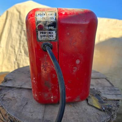 Two Blitzer Electric fence chargers with electric fence insulators / fencing items and spool of repair wire