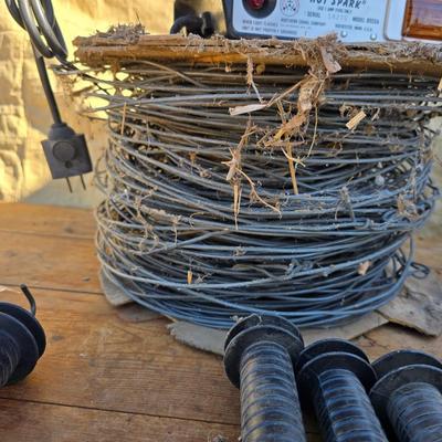 Two Blitzer Electric fence chargers with electric fence insulators / fencing items and spool of repair wire