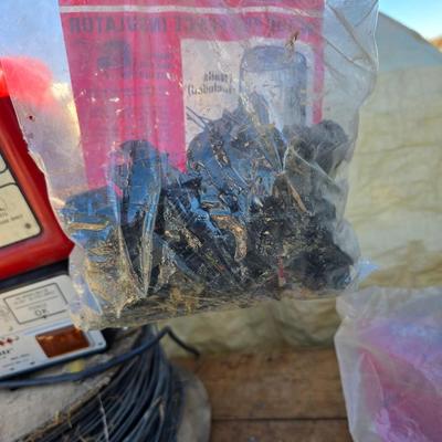 Two Blitzer Electric fence chargers with electric fence insulators / fencing items and spool of repair wire