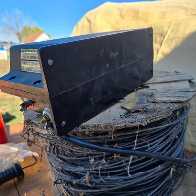 Two Blitzer Electric fence chargers with electric fence insulators / fencing items and spool of repair wire