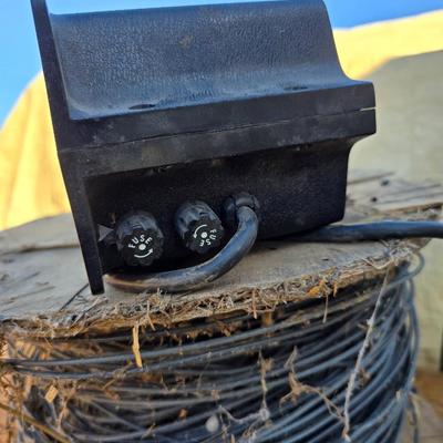 Two Blitzer Electric fence chargers with electric fence insulators / fencing items and spool of repair wire