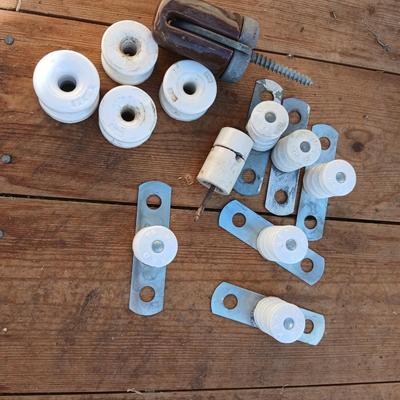 Antique porcelain insulators - cast iron - wrenches - and other rustic farm items for the side of the farm shed!