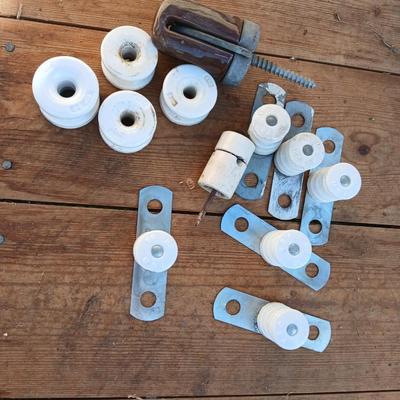 Antique porcelain insulators - cast iron - wrenches - and other rustic farm items for the side of the farm shed!