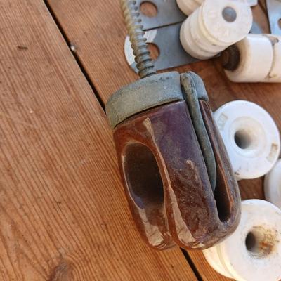 Antique porcelain insulators - cast iron - wrenches - and other rustic farm items for the side of the farm shed!