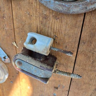 Antique porcelain insulators - cast iron - wrenches - and other rustic farm items for the side of the farm shed!