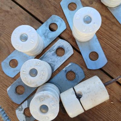 Antique porcelain insulators - cast iron - wrenches - and other rustic farm items for the side of the farm shed!