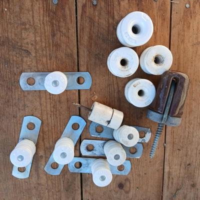 Antique porcelain insulators - cast iron - wrenches - and other rustic farm items for the side of the farm shed!