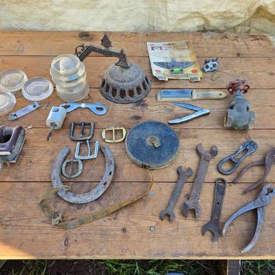 Antique porcelain insulators - cast iron - wrenches - and other rustic farm items for the side of the farm shed!