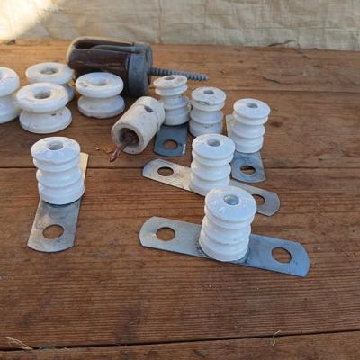Antique porcelain insulators - cast iron - wrenches - and other rustic farm items for the side of the farm shed!