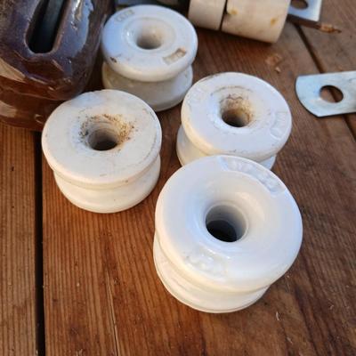 Antique porcelain insulators - cast iron - wrenches - and other rustic farm items for the side of the farm shed!