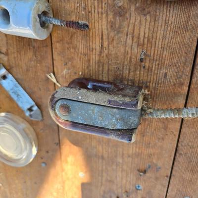 Antique porcelain insulators - cast iron - wrenches - and other rustic farm items for the side of the farm shed!