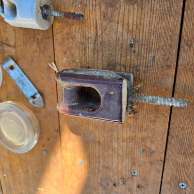 Antique porcelain insulators - cast iron - wrenches - and other rustic farm items for the side of the farm shed!