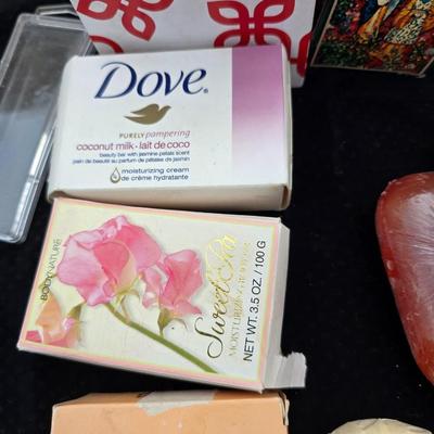 Grouping of bath soaps - scented - pill organizers - and a new shower curtain liner