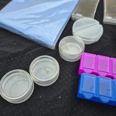 Grouping of bath soaps - scented - pill organizers - and a new shower curtain liner