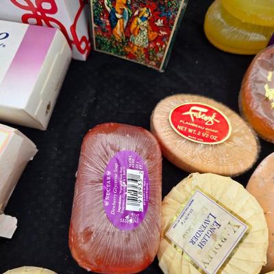 Grouping of bath soaps - scented - pill organizers - and a new shower curtain liner